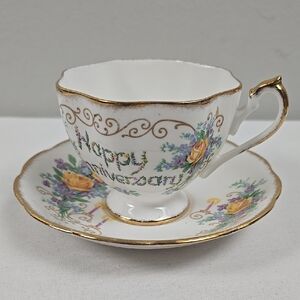 Antique Queen Anne Bone China Happy Anniversary footed Teacup and Saucer